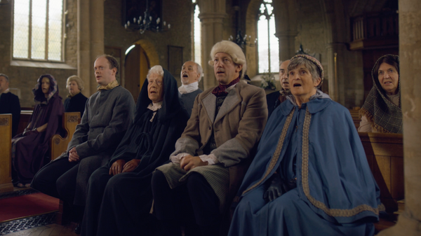 Congregation singing in pews